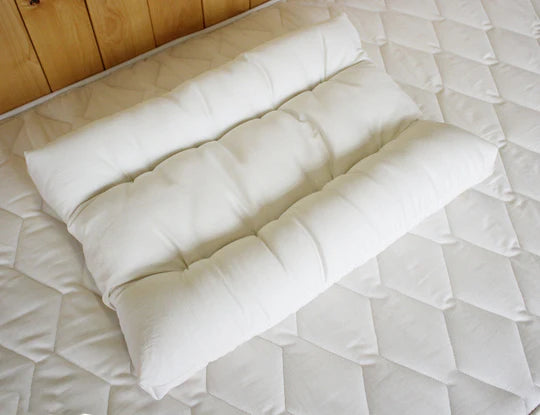 Orthopedic neck pillow by Holy Lamb Organics, plush memory foam pillow designed for neck support and comfort.