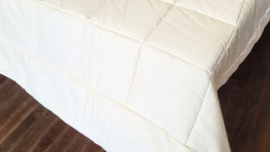 Soaring Heart quilted cotton comforter with a soft, plush appearance, showcasing its textured, cozy bedding design.