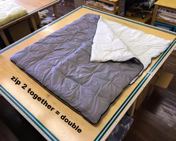 Holy Lamb Organics all-natural wool sleeping bag with two zippers, showcasing soft, warm, and eco-friendly material for restful sleep.