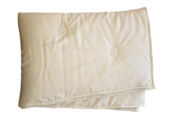 Certified organic toddler wool comforter for babies by Holy Lamb Organics, soft and cozy with natural wool texture.