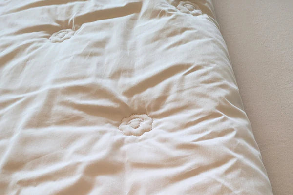 Organic toddler wool comforter for babies by Holy Lamb Organics, soft and cozy with natural wool fabric and gentle texture.