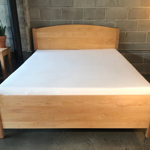 Holy Lamb Organics Wool & Latex Mattress, 6.5-inch thick, showing plush top surface and cozy bedding for restful sleep.