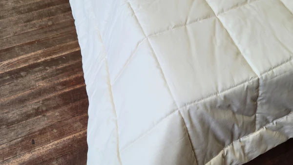 Soaring Heart quilted cotton comforter with a soft, plush texture and detailed stitching, perfect for cozy bedding.