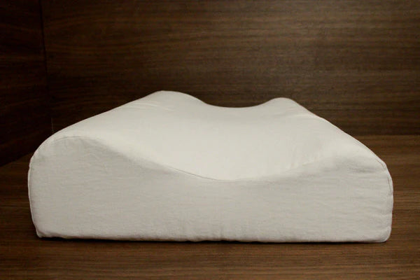 Organic latex pillow by Soaring Heart featuring ergonomic design with a contoured shape for comfortable sleep support.