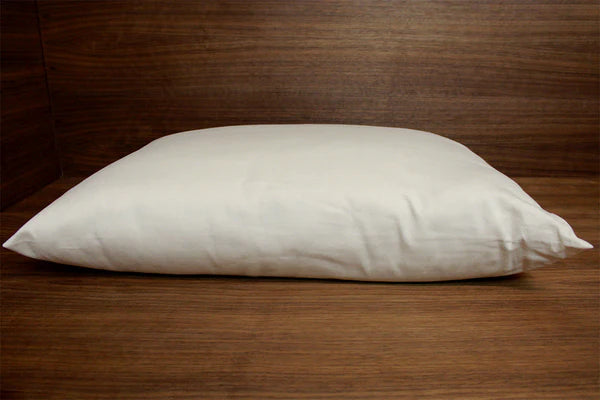 Natural Kapok pillow from Soaring Heart, showing a soft, plush pillow with a smooth fabric cover and gentle filling.