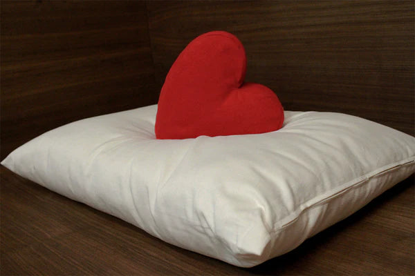 Natural Kapok pillow from Soaring Heart, showing soft, plush filling and a clean, white fabric cover for comfortable support.