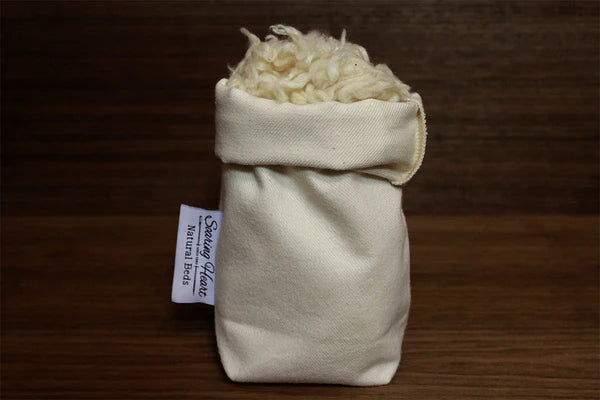 Natural Kapok pillow filled with soft, eco-friendly Kapok fiber from Soaring Heart, showcasing the pillow's plush, comfortable appearance.