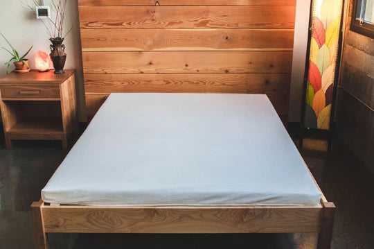 Wool and latex Shikibuton mattress by Holy Lamb Organics, showcasing a plush, natural fabric cover and layered construction.