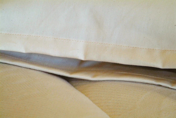 Holy Lamb Organics baby travel pillow, natural comfort travel pillow with soft fabric and supportive design for infants.