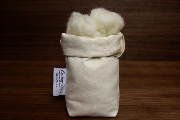Organic wool-filled body pillow by Soaring Heart, showcasing a soft, plush pillow designed for comfort and support.