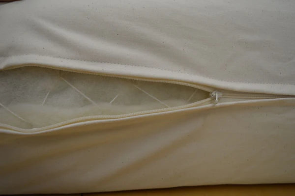 Close-up of Holy Lamb Organics Wool & Latex Mattress 6.5-inch layered construction with soft wool and latex materials.