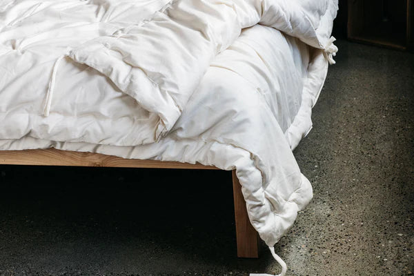 All-Season Wool Comforter by Holy Lamb Organics showing a cozy, plush comforter with a neutral fabric cover and soft filling.