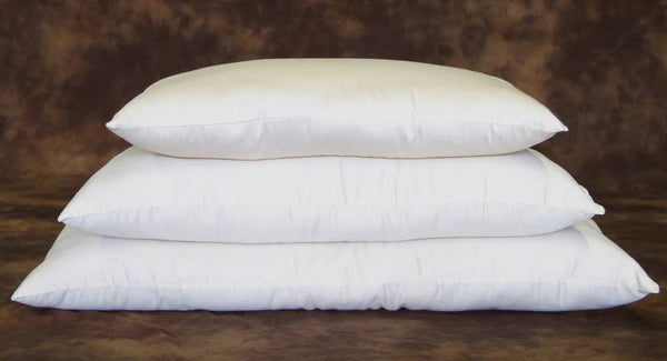 Certified organic wool bed pillows by Holy Lamb Organics, featuring soft, natural wool filling and a cozy fabric cover.