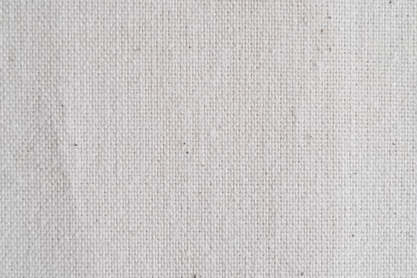 Close-up of Holy Lamb Organics Wool & Latex Mattress 6.5-inch thickness showing soft, natural fabric and plush surface detail.