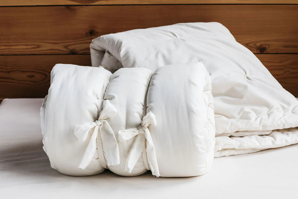 All-natural wool comforter from PM Bedding Store, soft and cozy bedding with plush wool filling on a neatly made bed.