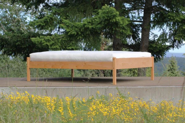 Organic cotton and wool futon mattress from Soaring Heart, showing a close-up of the natural fabric and plush filling.