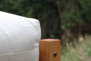 Organic cotton and wool futon from Soaring Heart, showing a neatly made traditional Japanese-style bedding on a wooden floor.