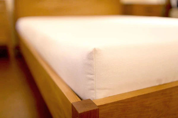 Organic latex mattress from Soaring Heart, showing a plush, eco-friendly latex mattress with a soft fabric cover and natural finish.