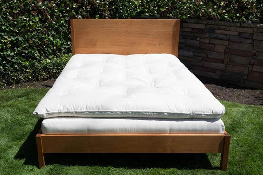 Royal Organic Latex & Wool Mattress Topper by Soaring Heart, showing plush latex and wool layer on a bed for added comfort.