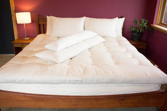 Certified organic body pillows from Holy Lamb Organics, soft and supportive pillows with a natural fabric cover.