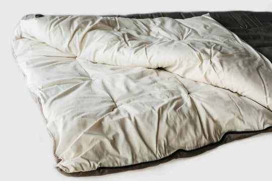 All-natural wool sleeping bag by Holy Lamb Organics, featuring cozy, soft wool fabric ideal for comfortable outdoor sleeping.