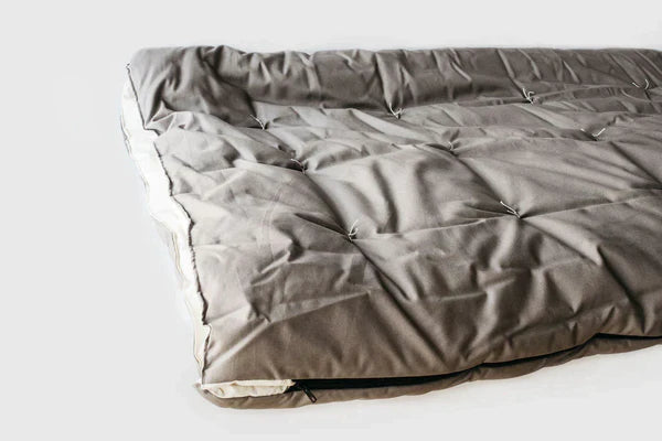 All-natural wool sleeping bag by Holy Lamb Organics, showing the cozy, insulated interior and soft exterior fabric.