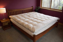 Organic quilted mattress topper by Holy Lamb Organics, soft and plush bedding layer for added comfort on your bed.
