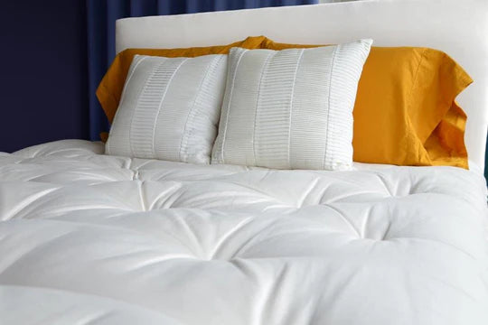 Organic wool mattress topper by Soaring Heart, plush and thick with natural wool fibers for added comfort and support.