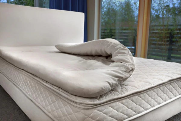 Organic latex mattress topper by Soaring Heart, plush and supportive layer for enhanced sleep comfort.